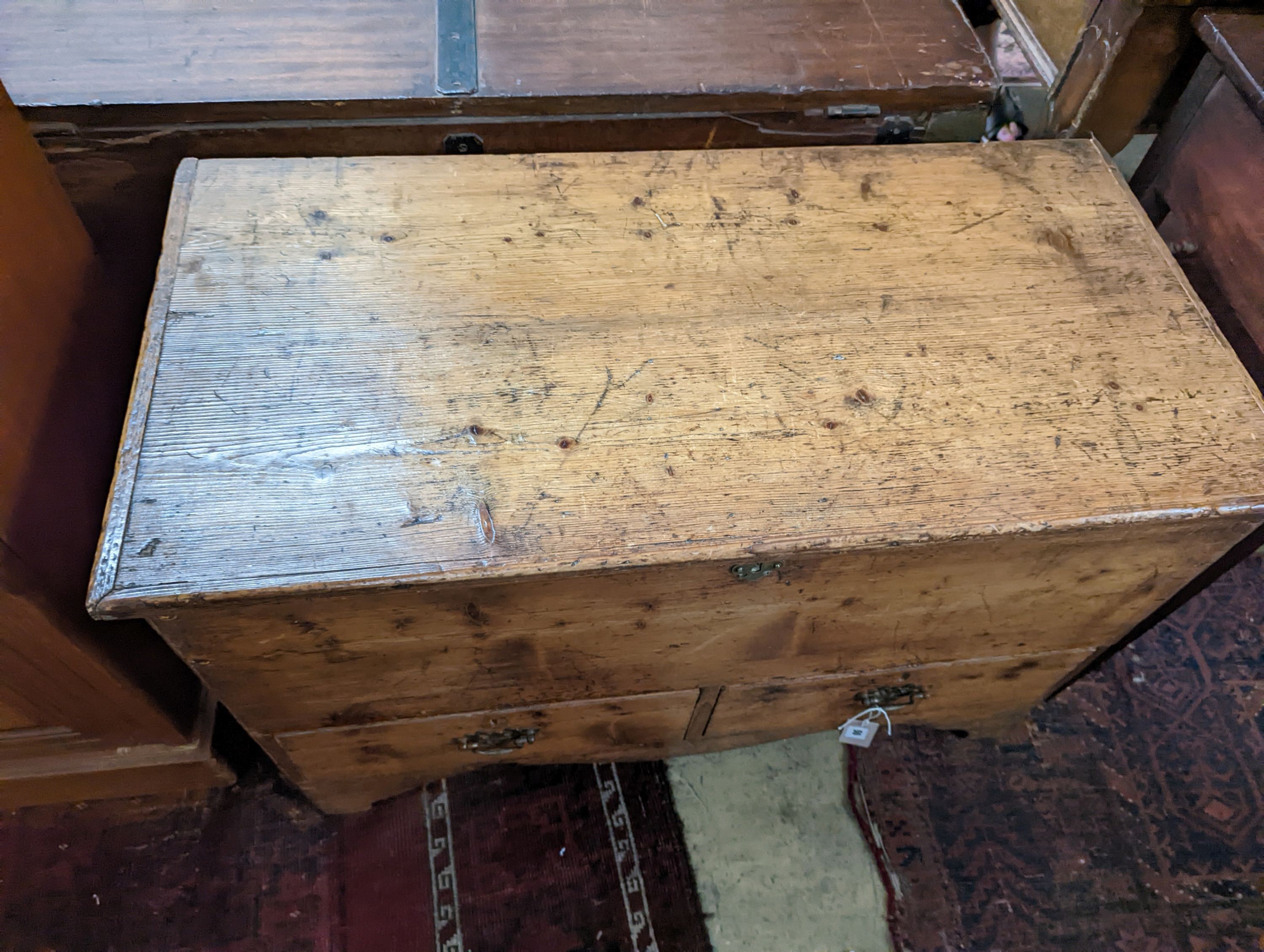 An early 19th century pine two drawer mule chest, length 90cm, depth 45cm, height 60cm